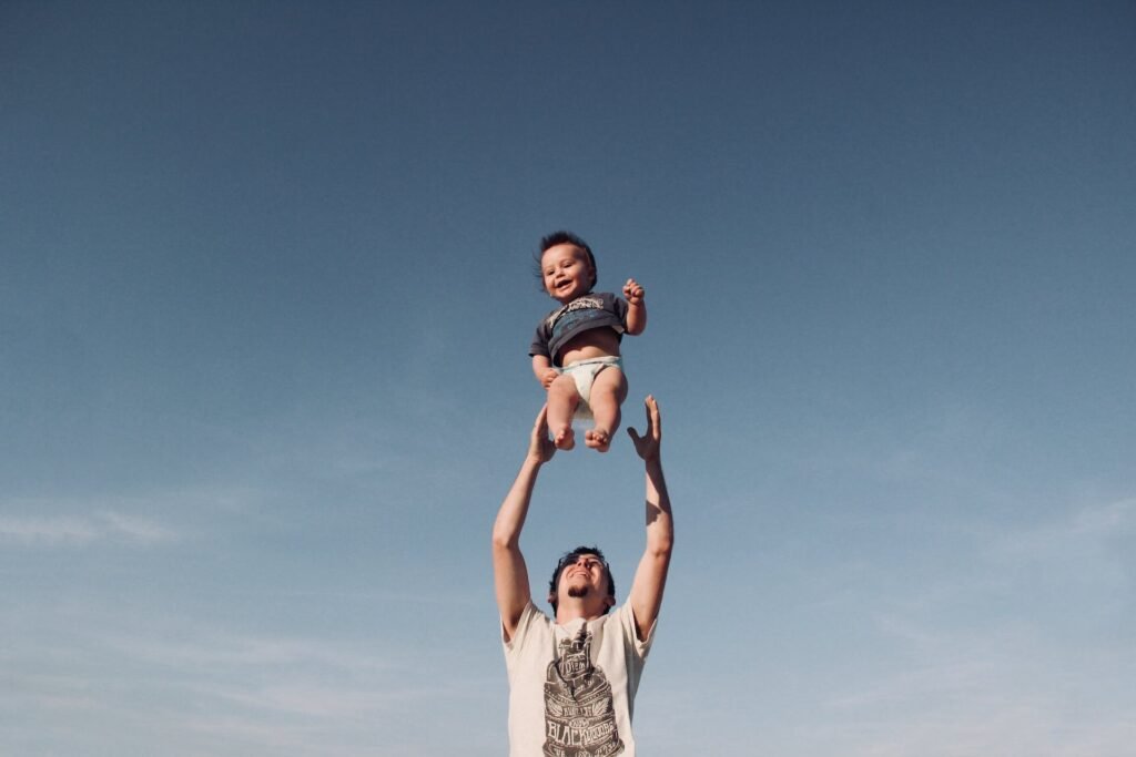 dad and a baby playing